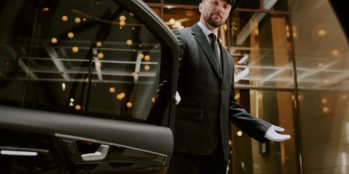Atlas Elite luxury chauffeur vehicle at night